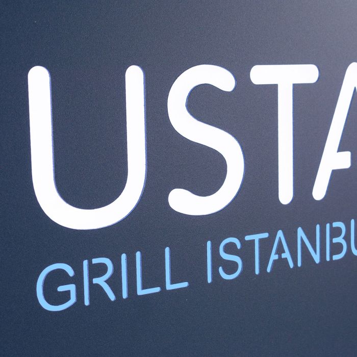 Backlit cutout logo on a menu case