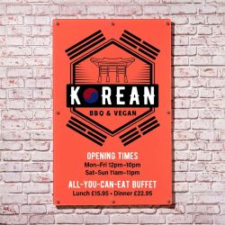 Vibrantly printed sign with Korean BBQ design in bright orange, wall mounted with compact silver metal fixings.