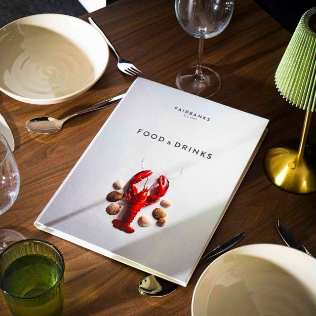 White Fairbanks menu with a lobster illustration