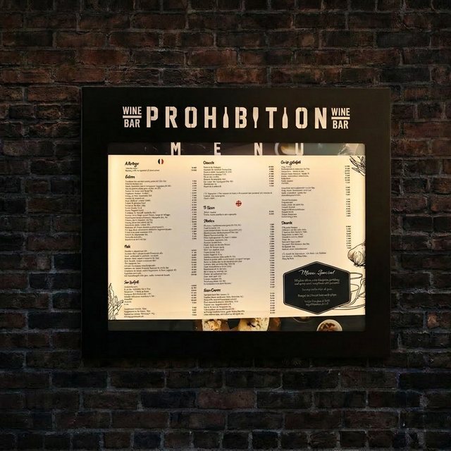 Illuminated wall-mounted display case for Prohibition Wine Bar