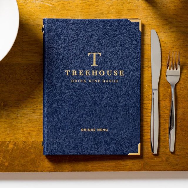 Blue Treehouse menu with a gold logo
